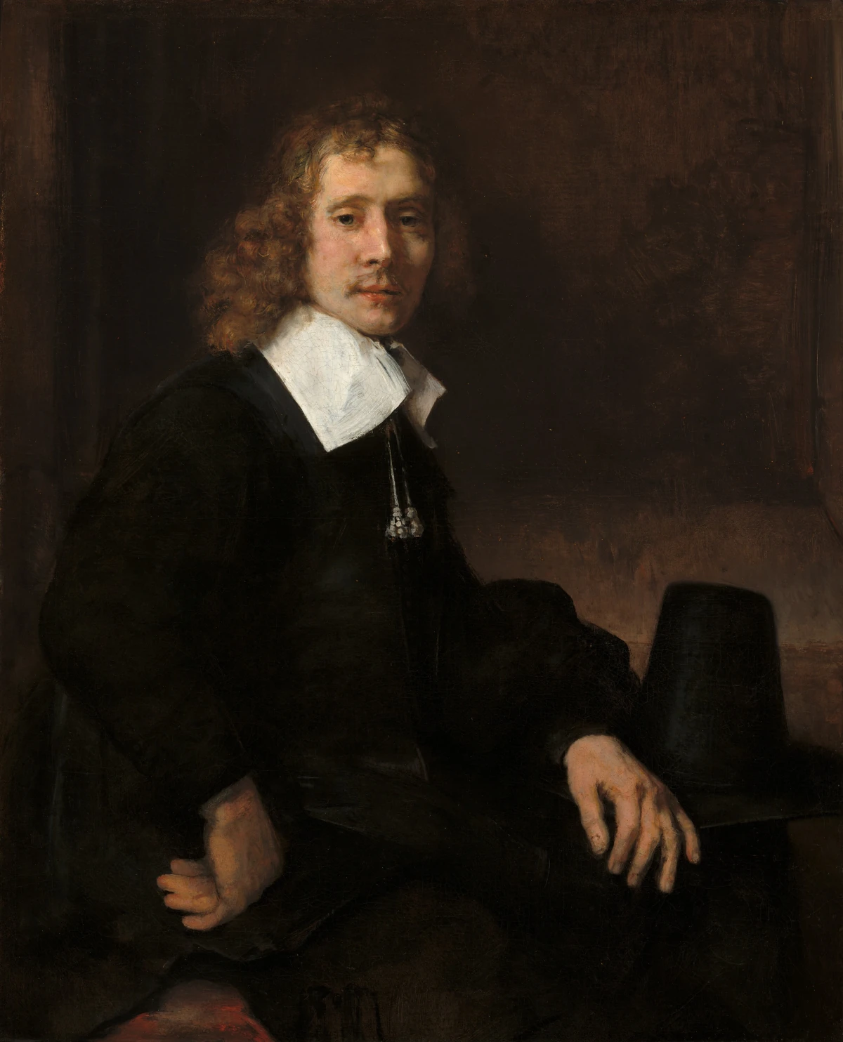 Un Jeune Homme Assis à une Table (possiblement Govaert Flinck) — Rembrandt van Rijn (1660) — oil on canvas, National Gallery of Art, Washington