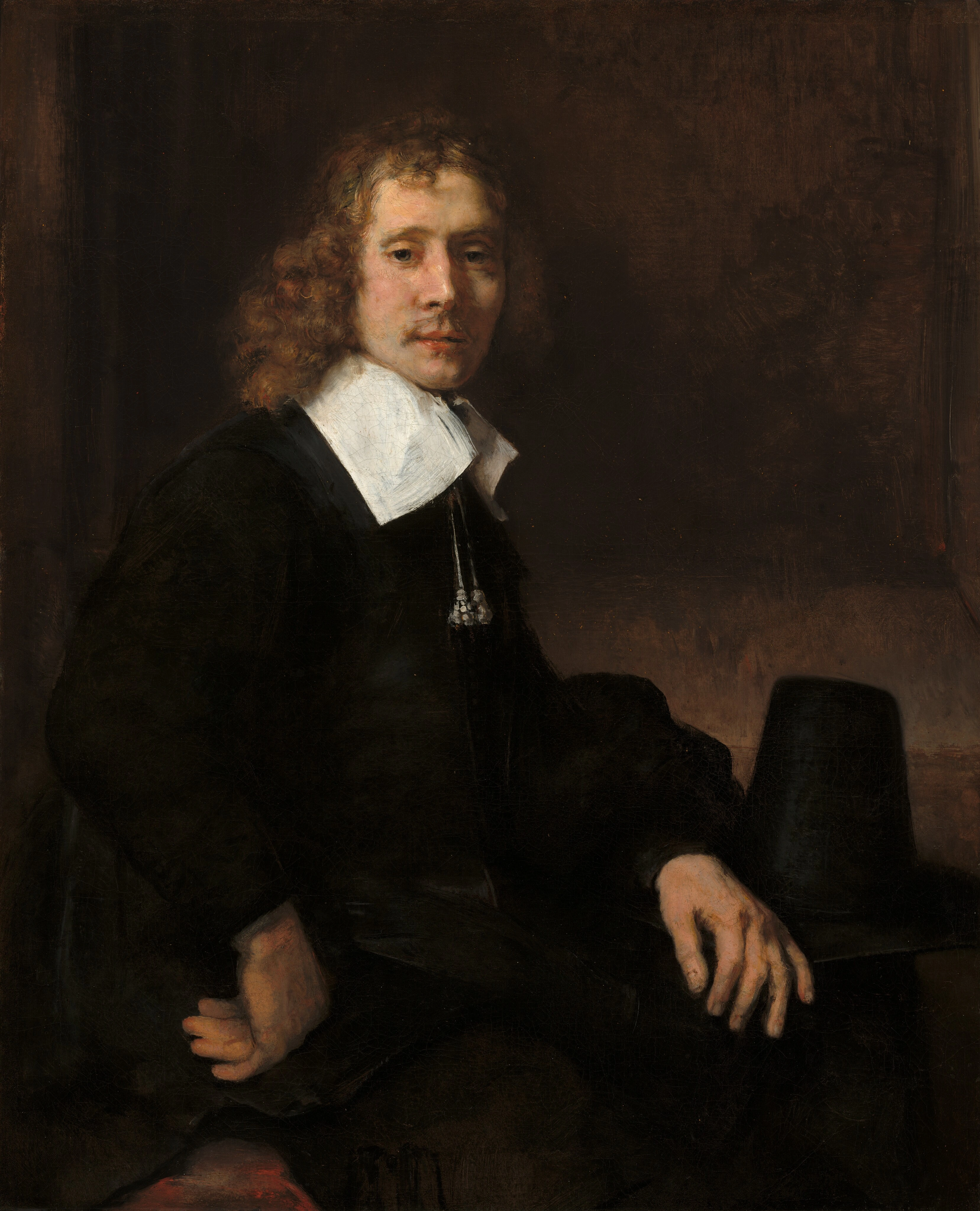 Un Jeune Homme Assis à une Table (possiblement Govaert Flinck)
